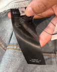 BALENCIAGA DOUBLE LAYERED DISTRESSED LOGO DENIM ‘BLUE/BLACK’