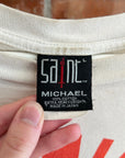 SAINT MICHAEL SPIRAL CIRCLE GRAPHIC TEE ‘MULTI’