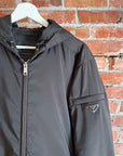 PRADA RE-NYLON PADDED HOODED JACKET ‘BLACK’
