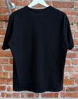 UNDERCOVER MADSTORE WE MAKE NOISE NOT CLOTHES TEE ‘BLACK’