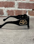 BALENCIAGA BLACK OVAL SUNGLASSES ‘BLACK/GOLD’
