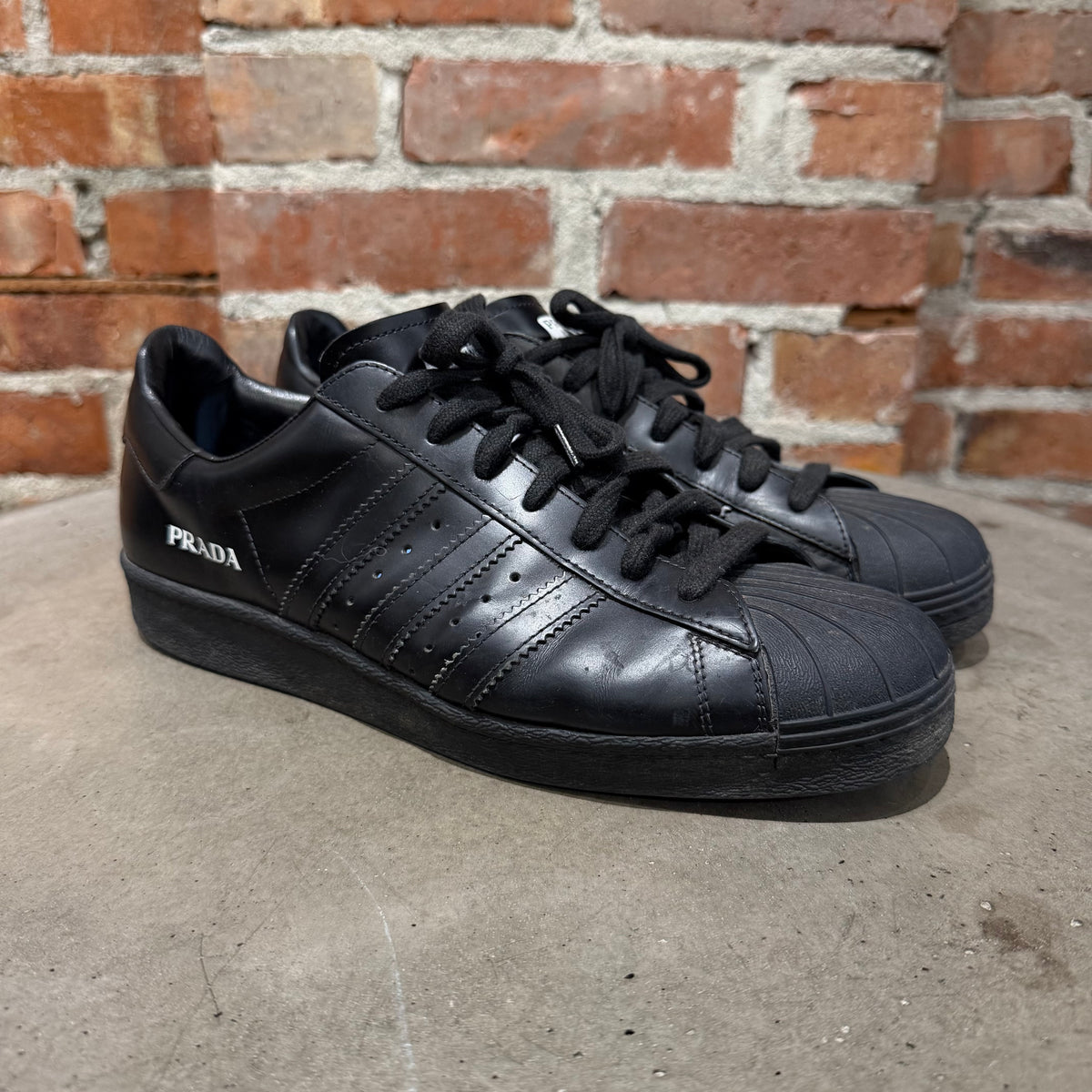 ADIDAS X PRADA MILANO LEATHER SUPERSTAR SNEAKERS ‘BLACK’