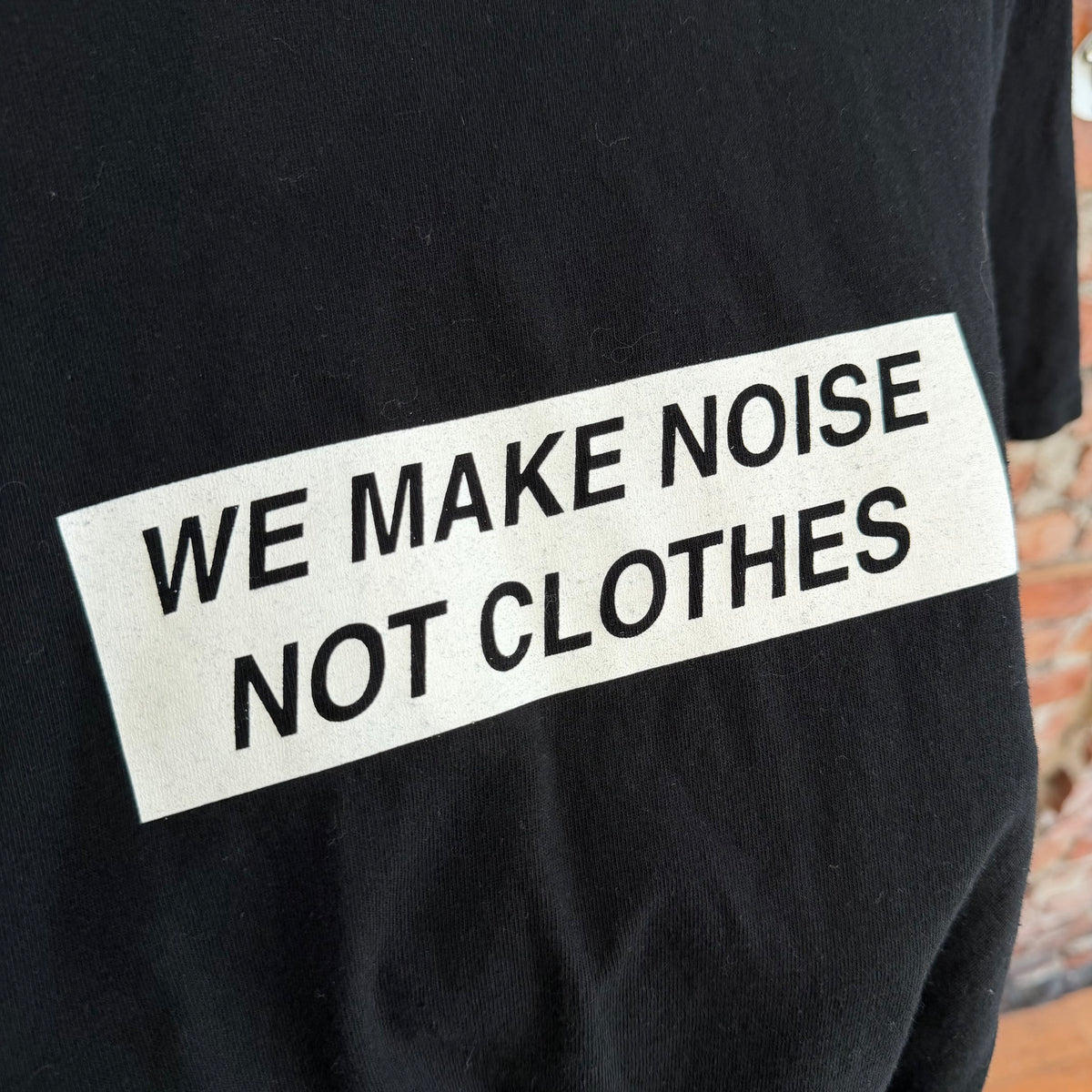 UNDERCOVER MADSTORE WE MAKE NOISE NOT CLOTHES TEE ‘BLACK’