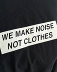UNDERCOVER MADSTORE WE MAKE NOISE NOT CLOTHES TEE ‘BLACK’