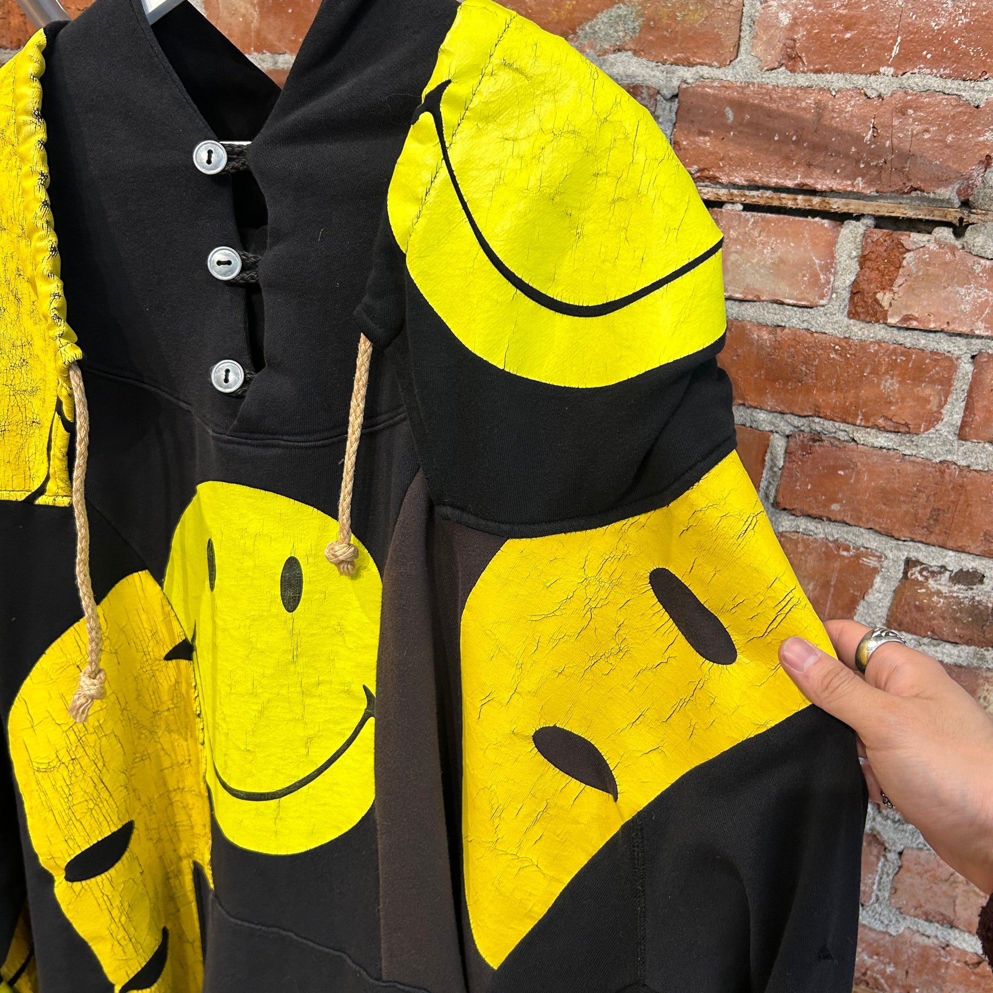 KAPITAL RECONSTRUCTED PATCHWORK SMILEY HOODIE ‘BLACK/YELLOW’