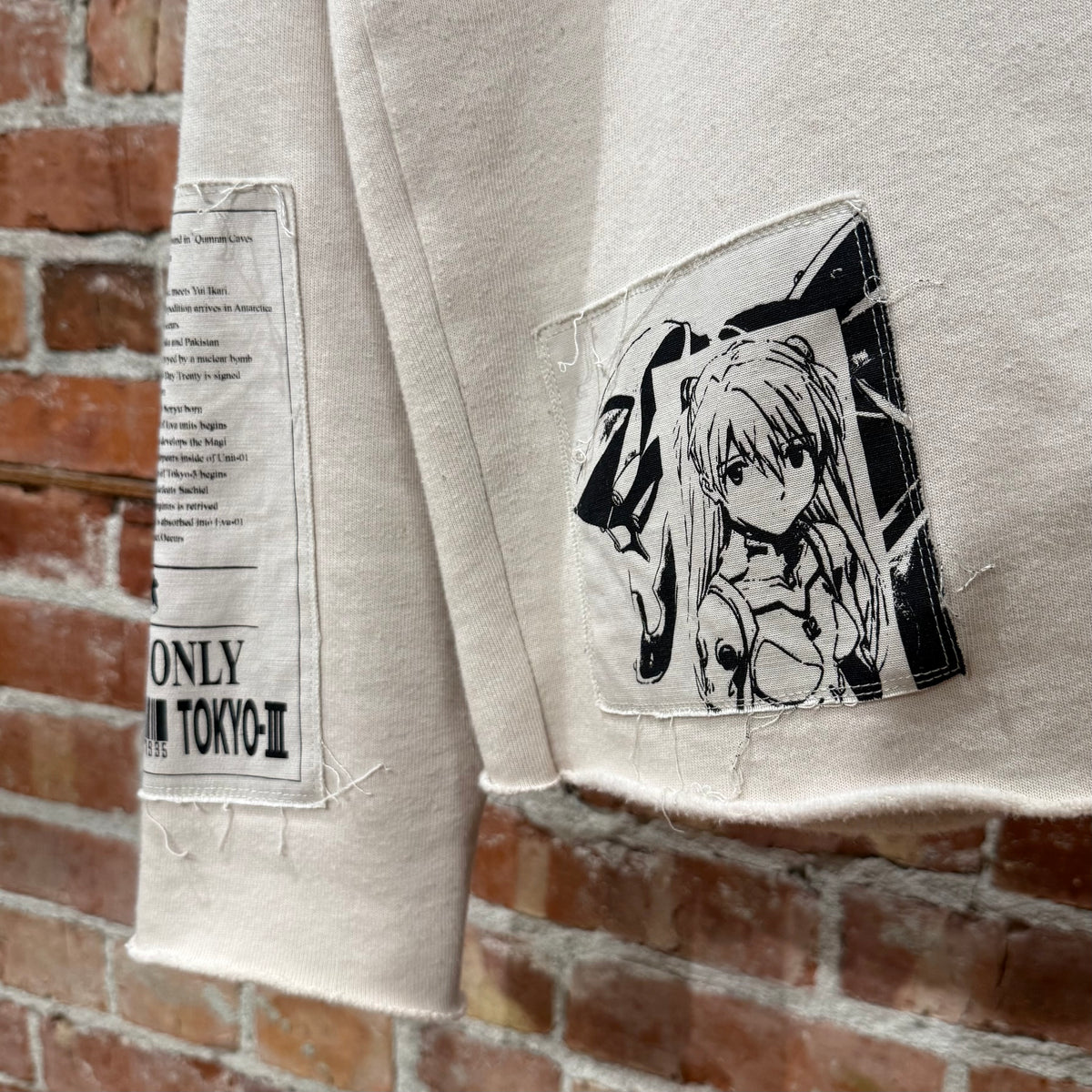 ROUGH SIMMONS EVANGELION PATCHWORK CREWNECK ‘CREAM’