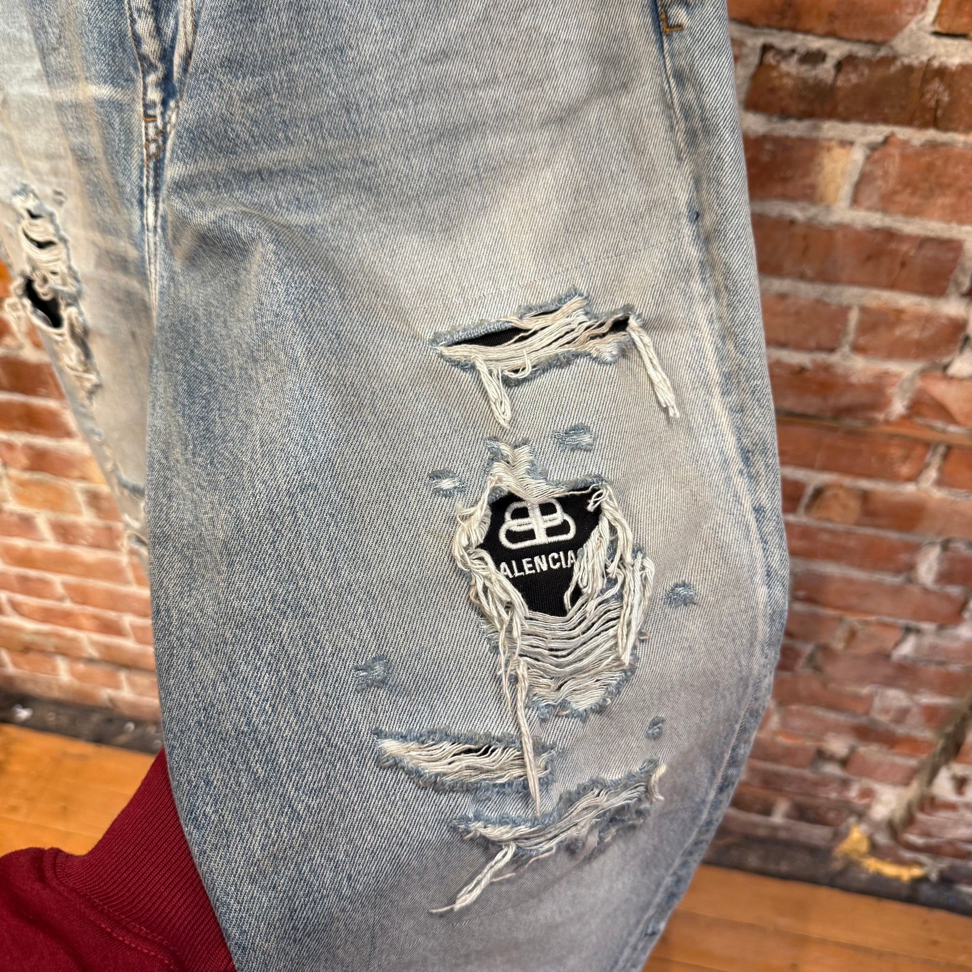 BALENCIAGA DOUBLE LAYERED DISTRESSED LOGO DENIM ‘BLUE/BLACK’