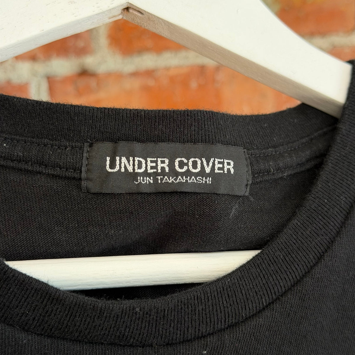 UNDERCOVER MADSTORE WE MAKE NOISE NOT CLOTHES TEE ‘BLACK’