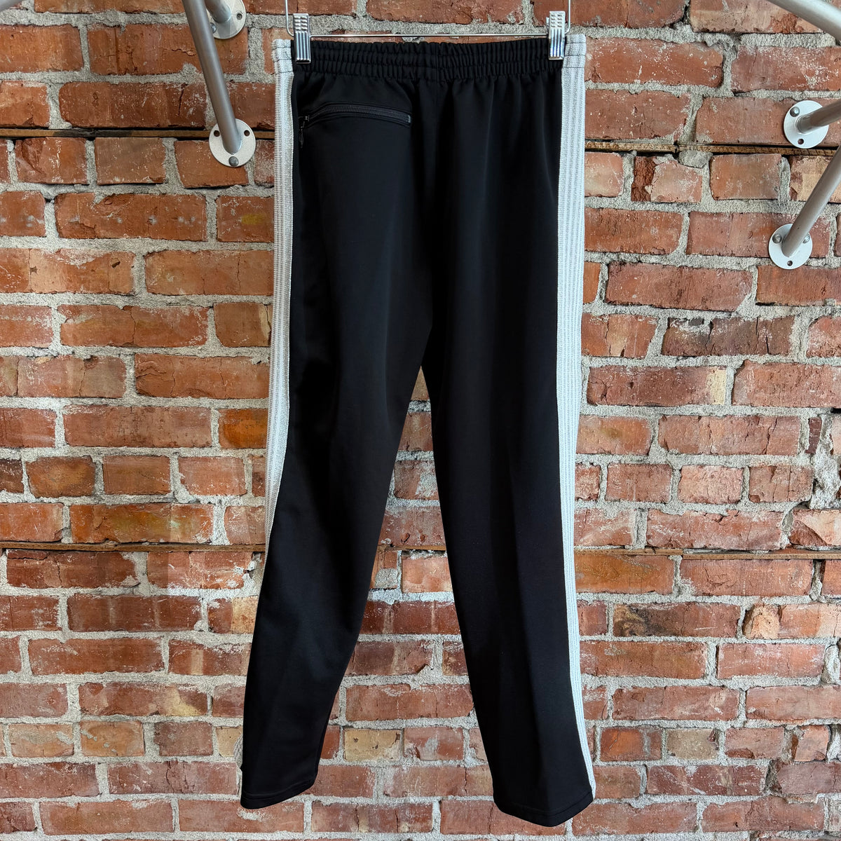 NEEDLES X AWGE TRACK PANTS ‘BLACK/SILVER’