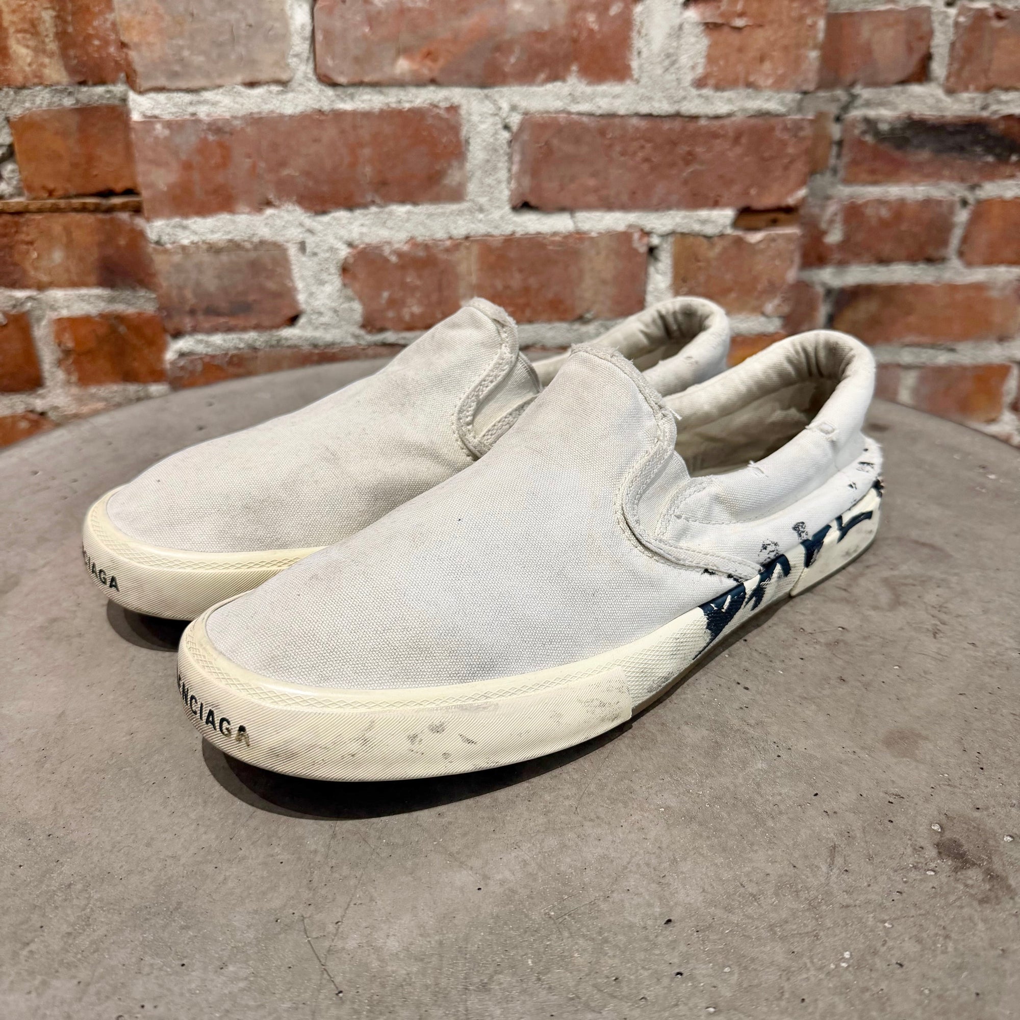 BALENCIAGA PARIS GRAFFITI SLIP ON SNEAKERS ‘WHITE’
