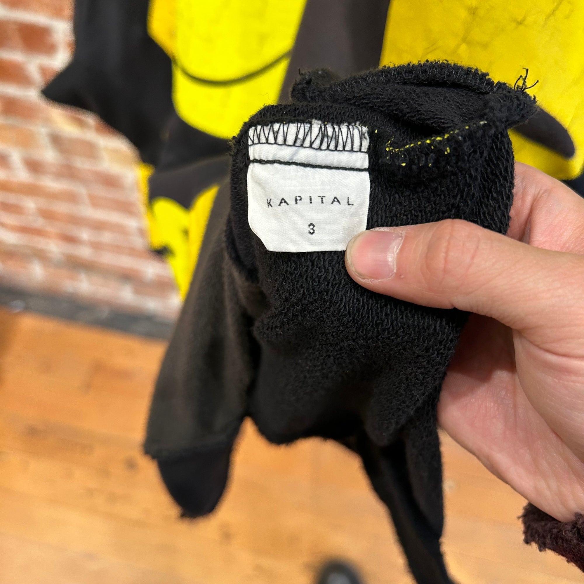 KAPITAL RECONSTRUCTED PATCHWORK SMILEY HOODIE ‘BLACK/YELLOW’