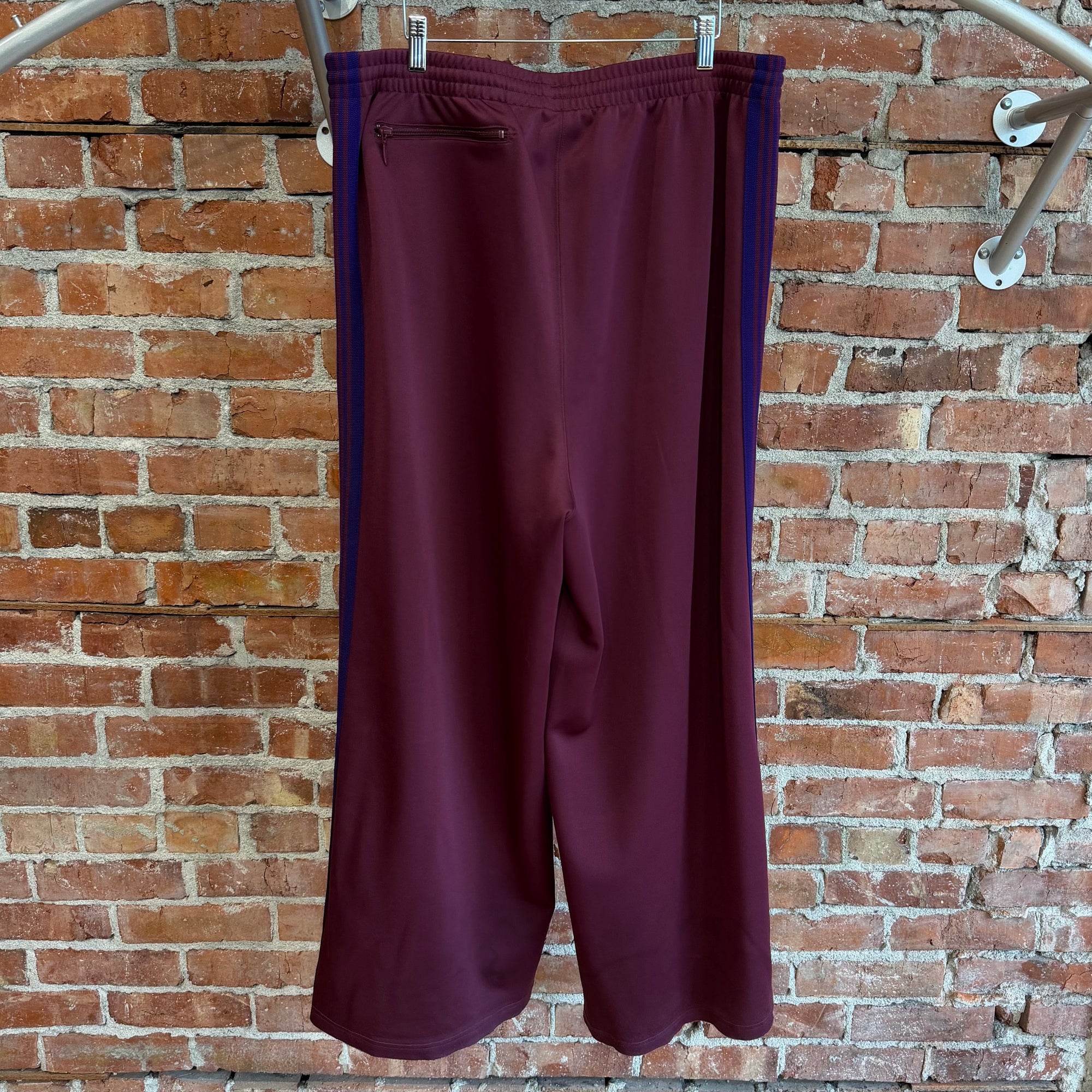 NEEDLES WIDE HD TRACK PANTS ‘MAROON/PURPLE’