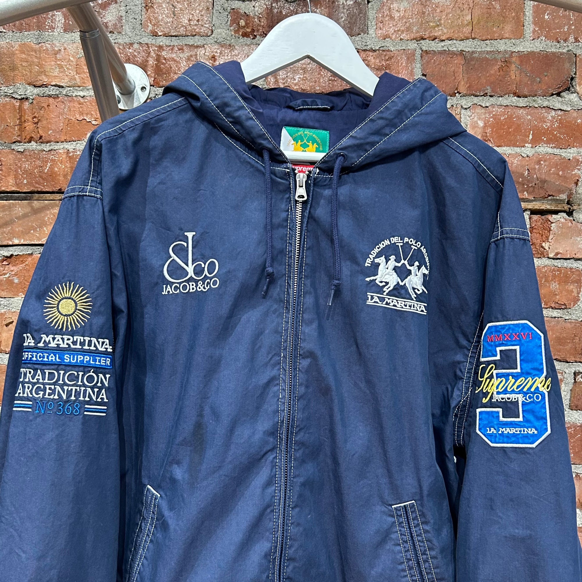 SUPREME X JACOB &amp; CO X LA MARTINA SS26 HOODED JACKET ‘NAVY’