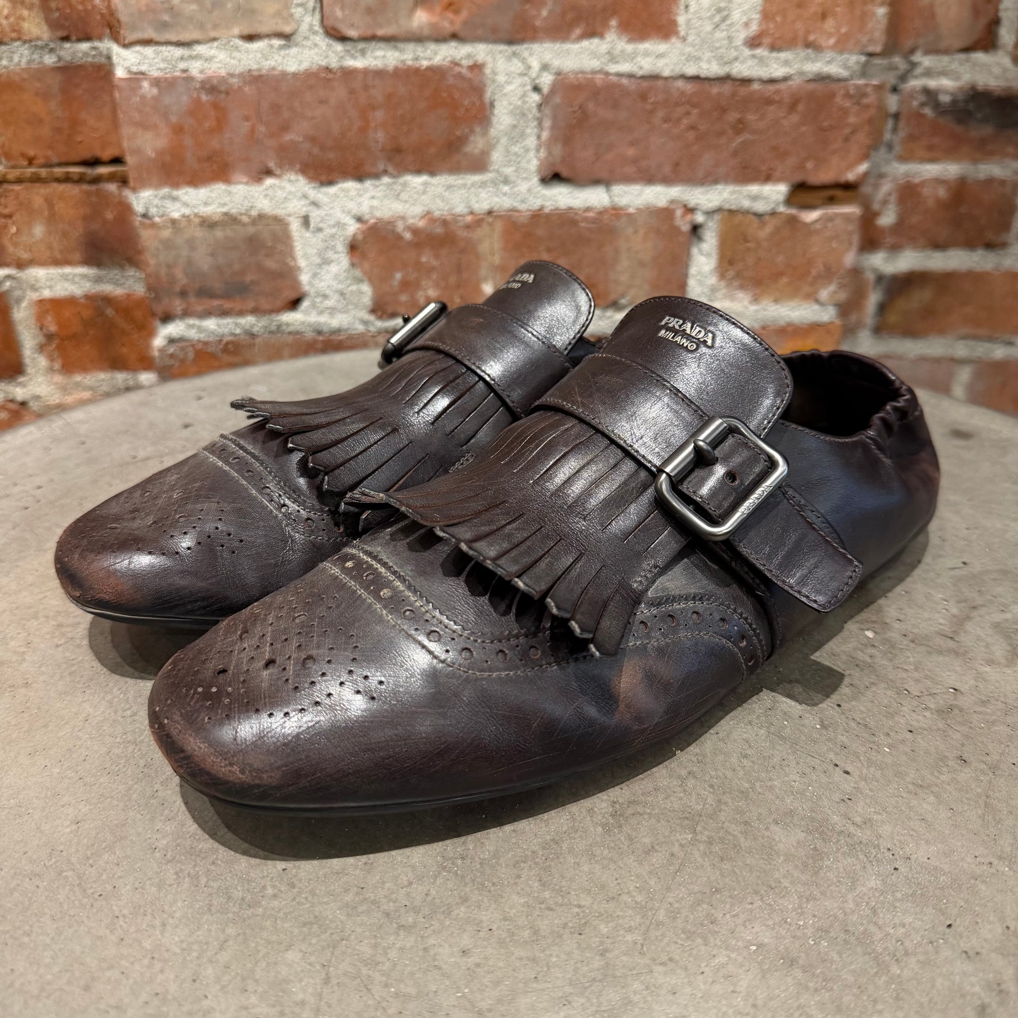 PRADA SS25 FRINGED MONK STRAP SHUFFLE LOAFERS ‘BROWN’