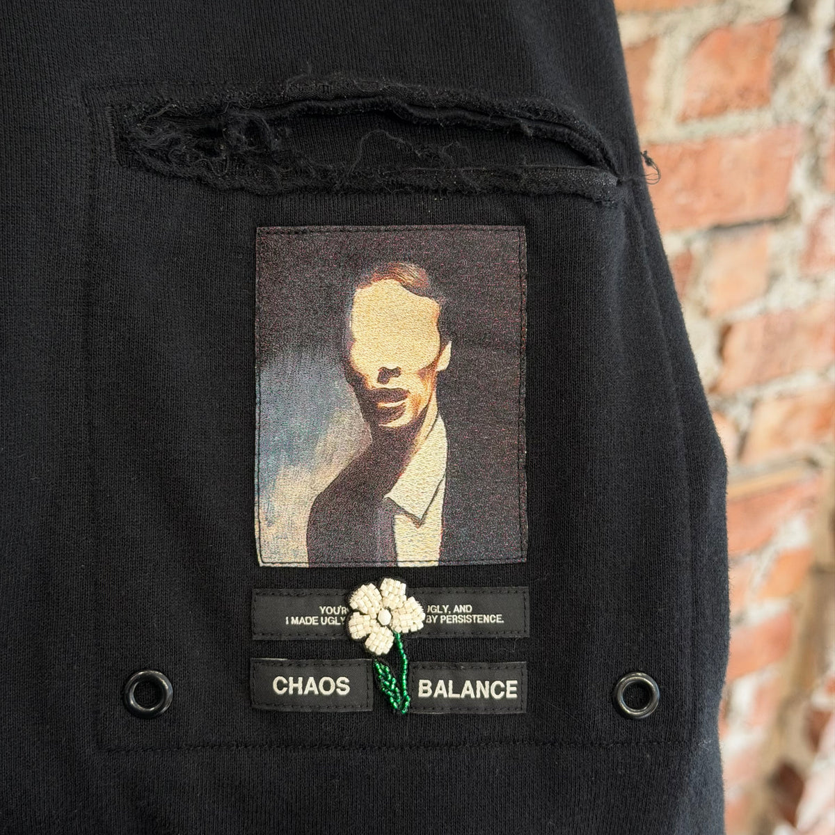 UNDERCOVER SS25 CHAOS BALANCE PATCH LONG SLEEVE ‘BLACK’