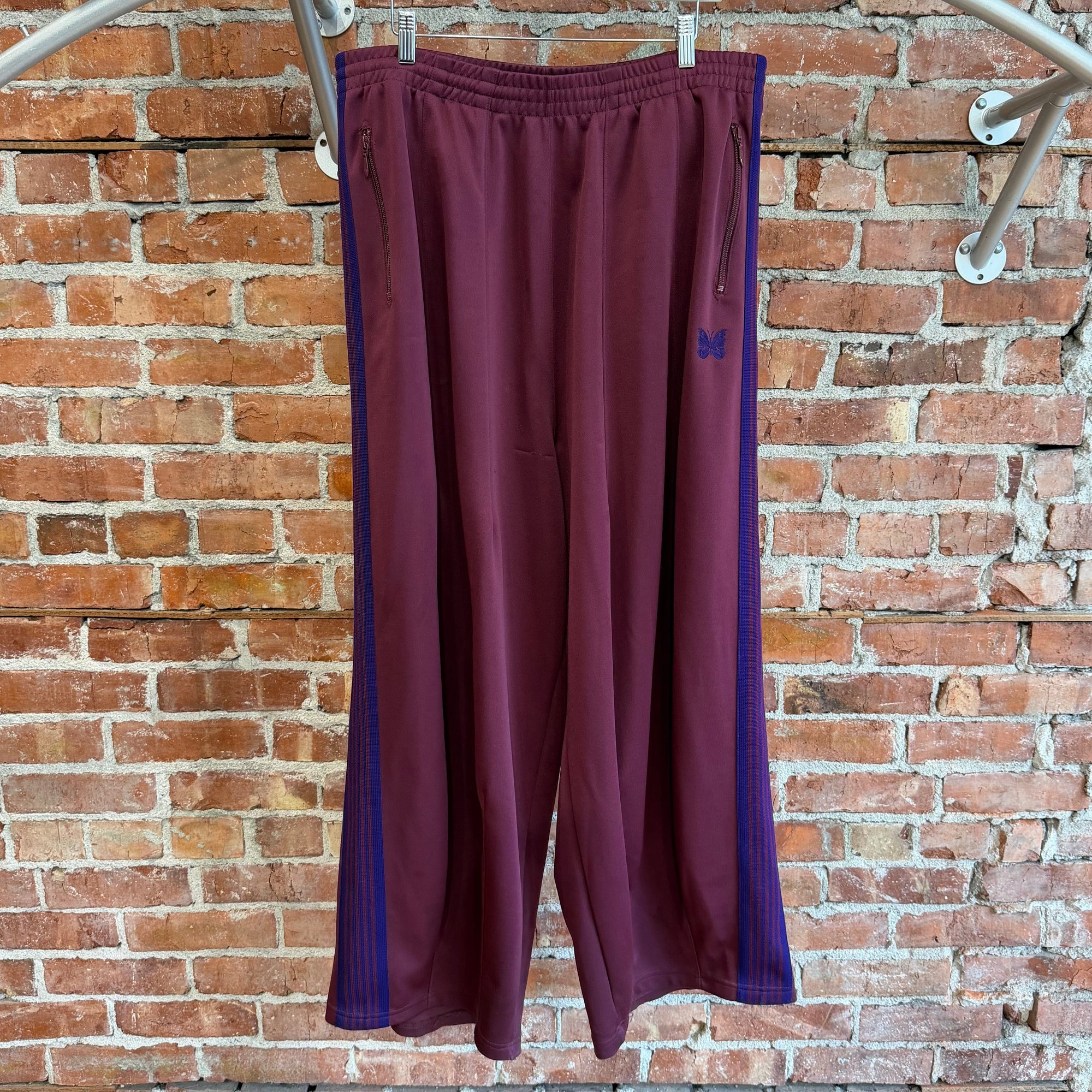 NEEDLES WIDE HD TRACK PANTS ‘MAROON/PURPLE’