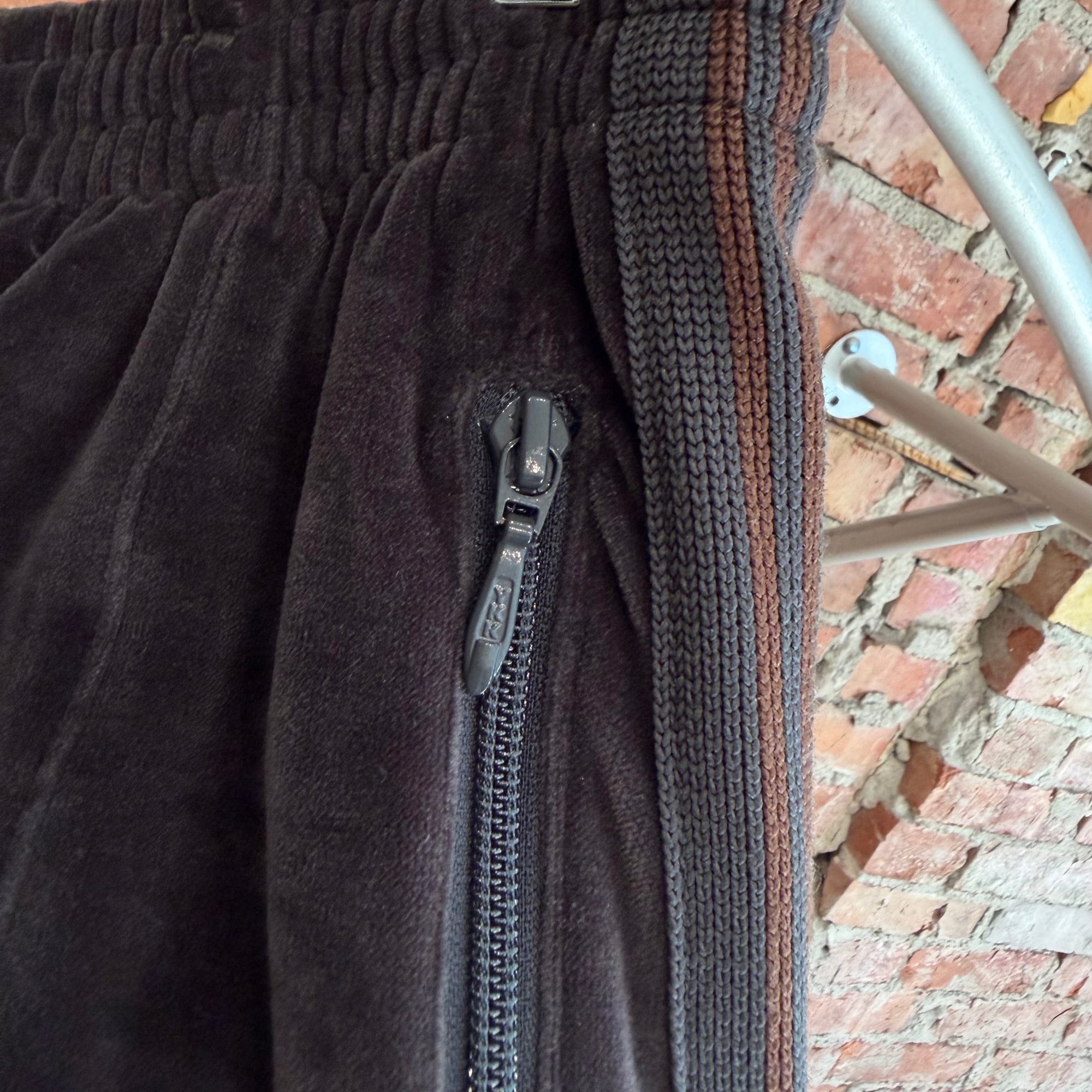 NEEDLES HD TRACK PANTS ‘DARK GRAY/COPPER’