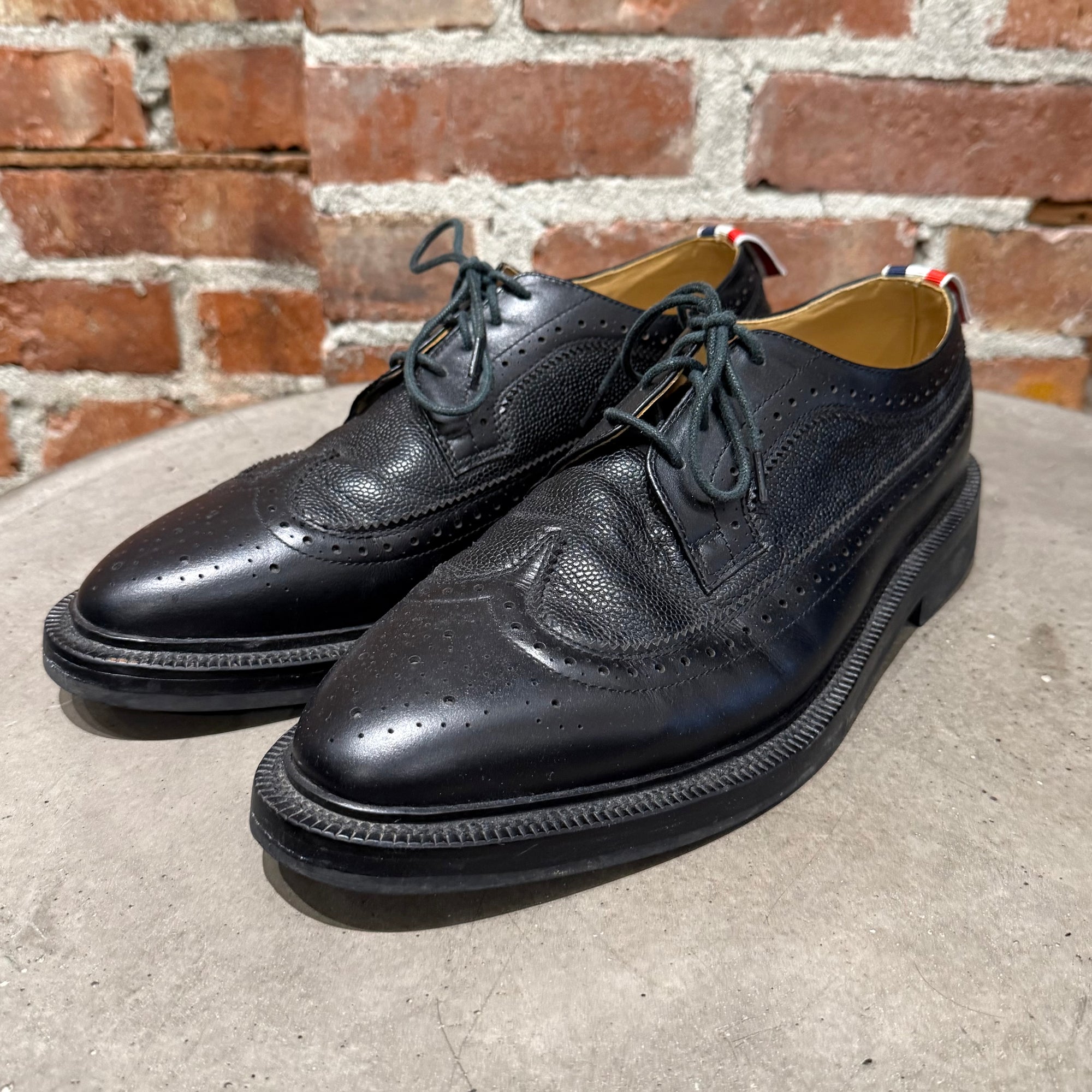 THOM BROWNE PEBBLE-GRAIN LONGWING BROGUES ‘BLACK’