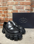 PRADA LEATHER MONOLITH LOAFERS ‘BLACK’