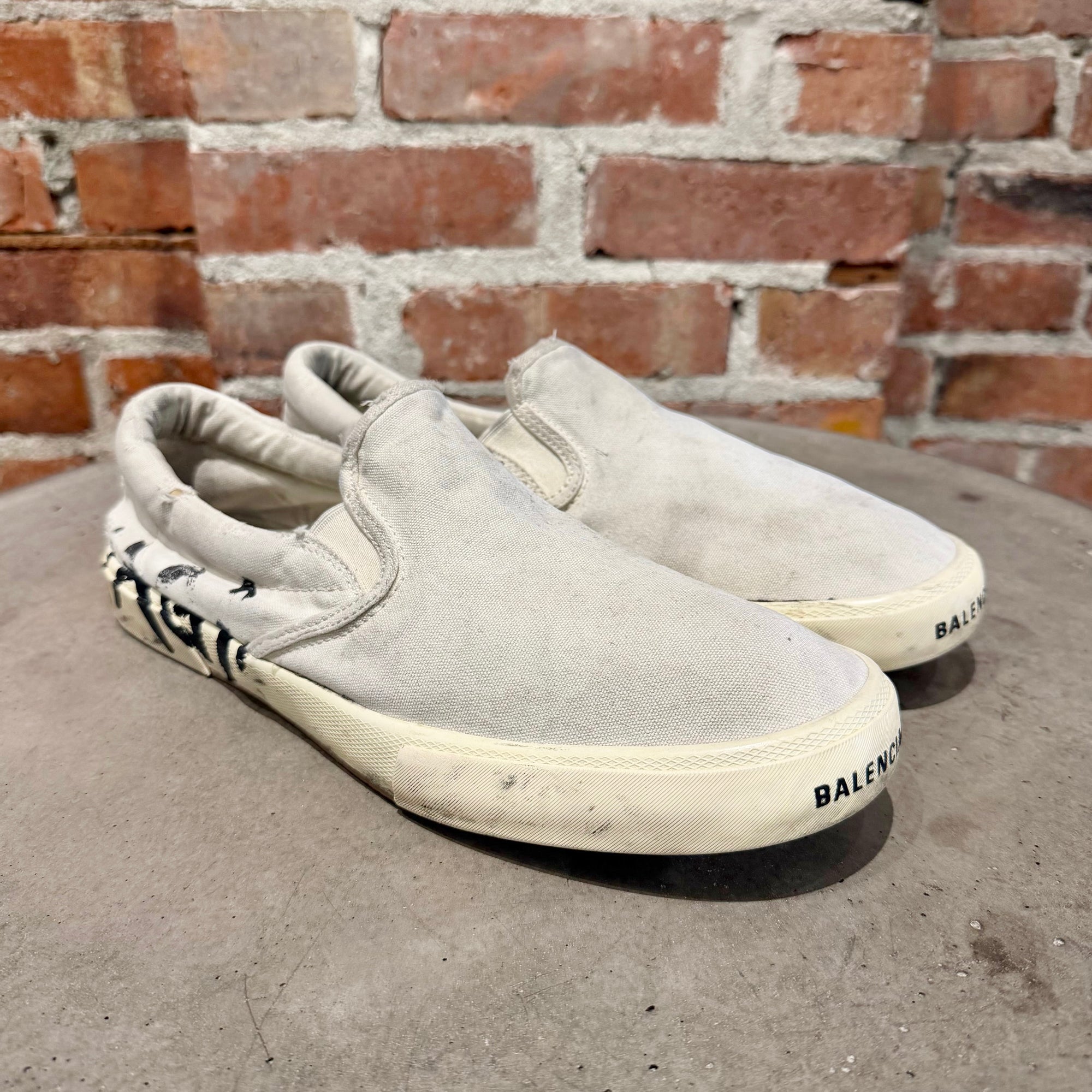 BALENCIAGA PARIS GRAFFITI SLIP ON SNEAKERS ‘WHITE’