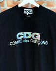 COMME DES GARÇON DSM EXCLUSIVE HOLOGRAPHIC LOGO TEE ‘BLACK’