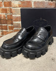 PRADA LEATHER MONOLITH LOAFERS ‘BLACK’