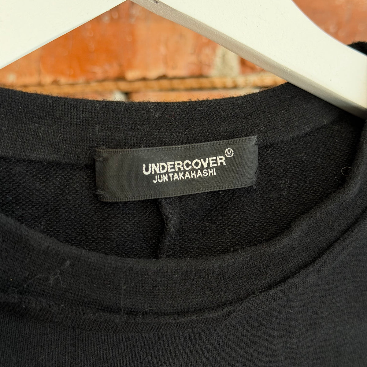 UNDERCOVER SS25 CHAOS BALANCE PATCH LONG SLEEVE ‘BLACK’