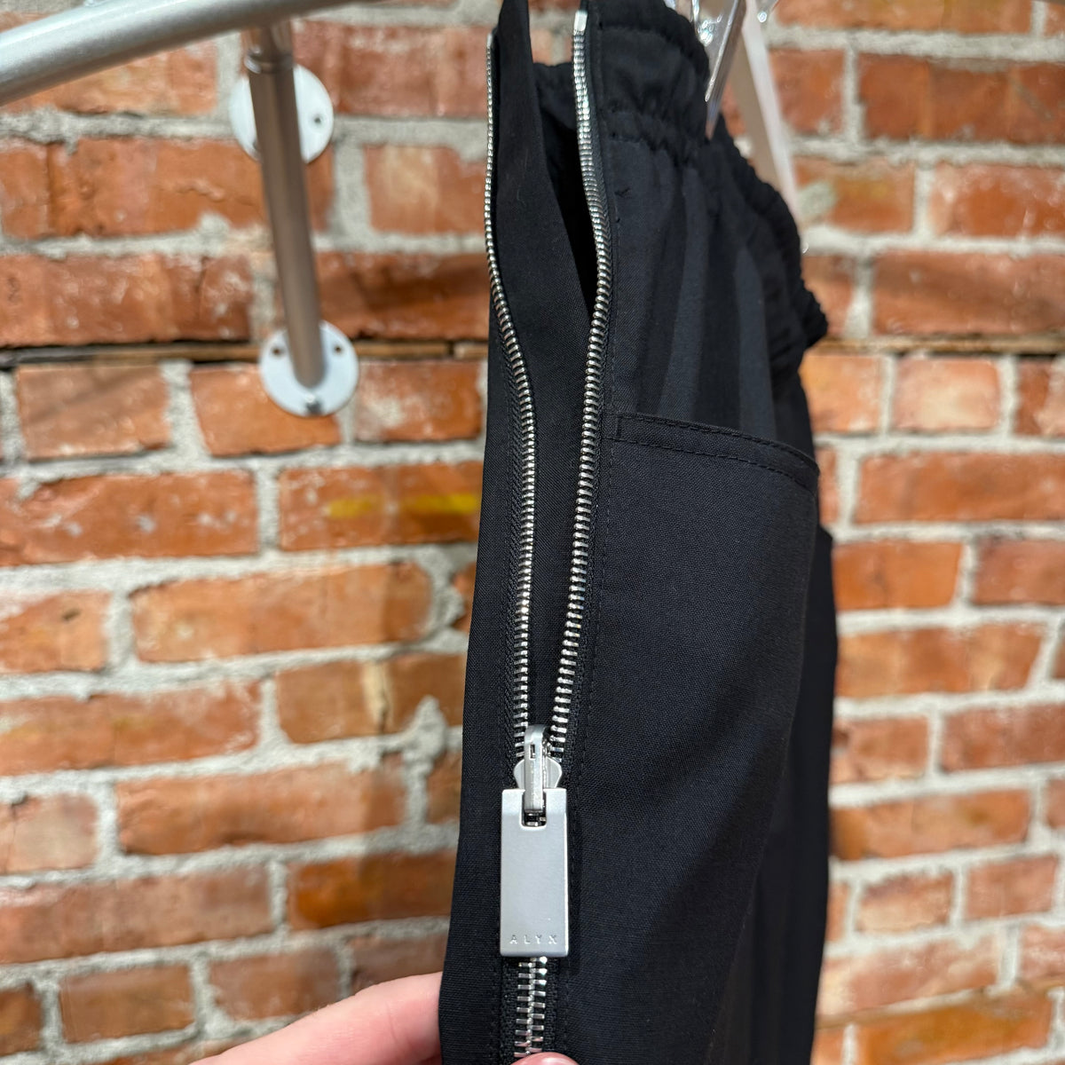 1017 ALYX 9SM ZIPPER TRACK PANTS ‘BLACK’