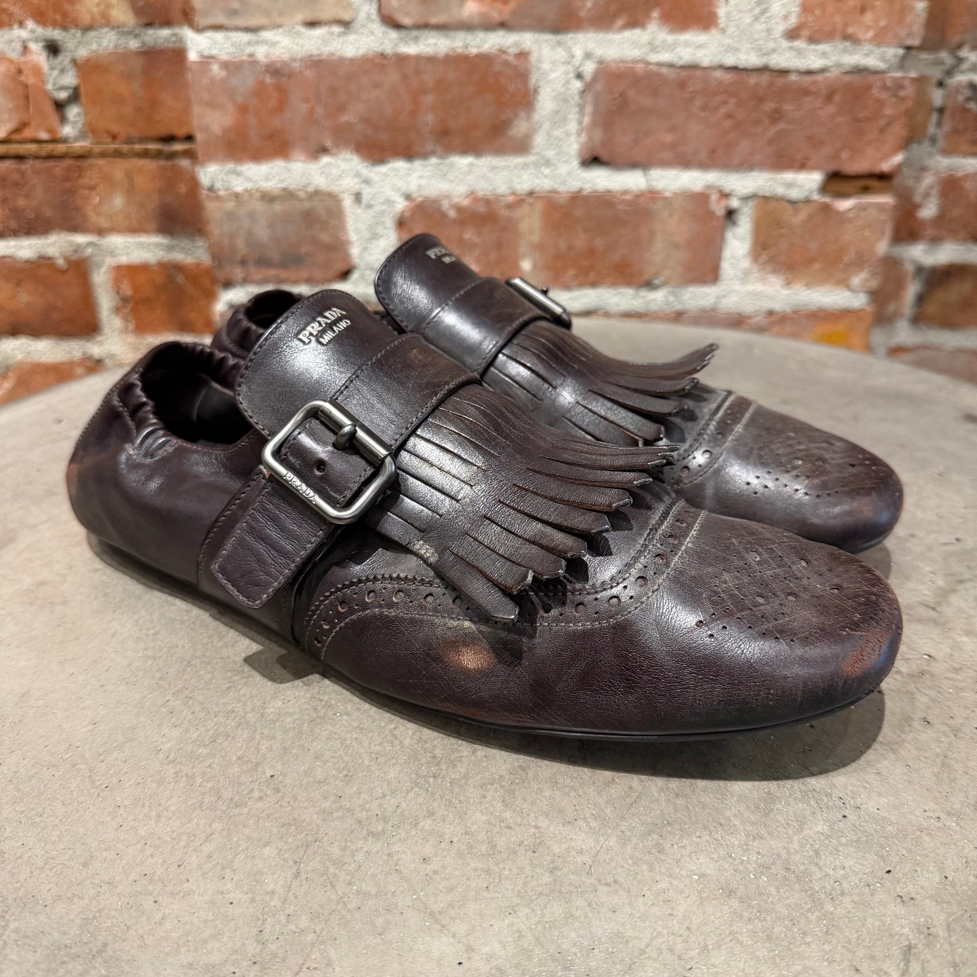 PRADA SS25 FRINGED MONK STRAP SHUFFLE LOAFERS ‘BROWN’