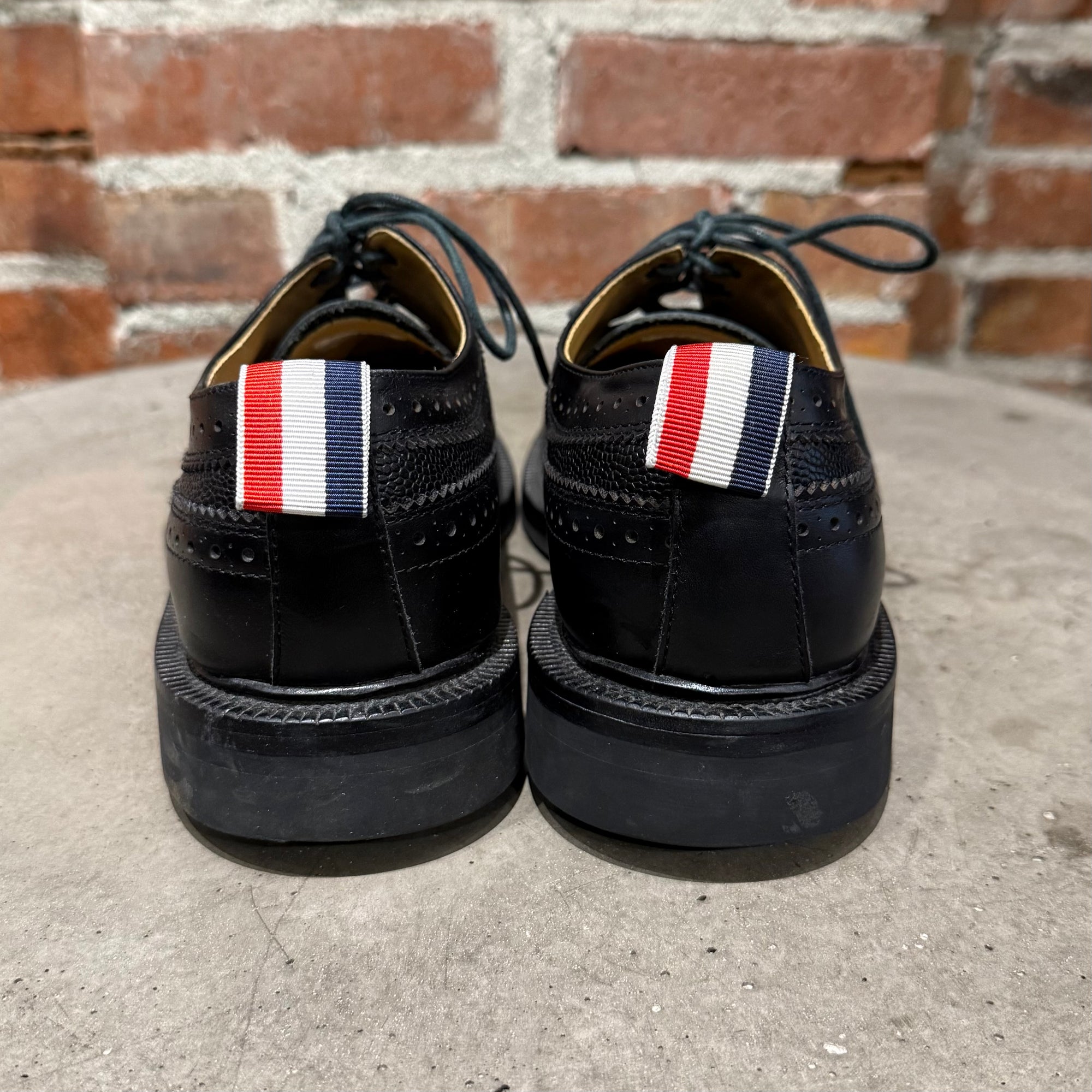 THOM BROWNE PEBBLE-GRAIN LONGWING BROGUES ‘BLACK’