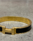 HERMES CLICK BRACELET ‘GOLD/BLACK’