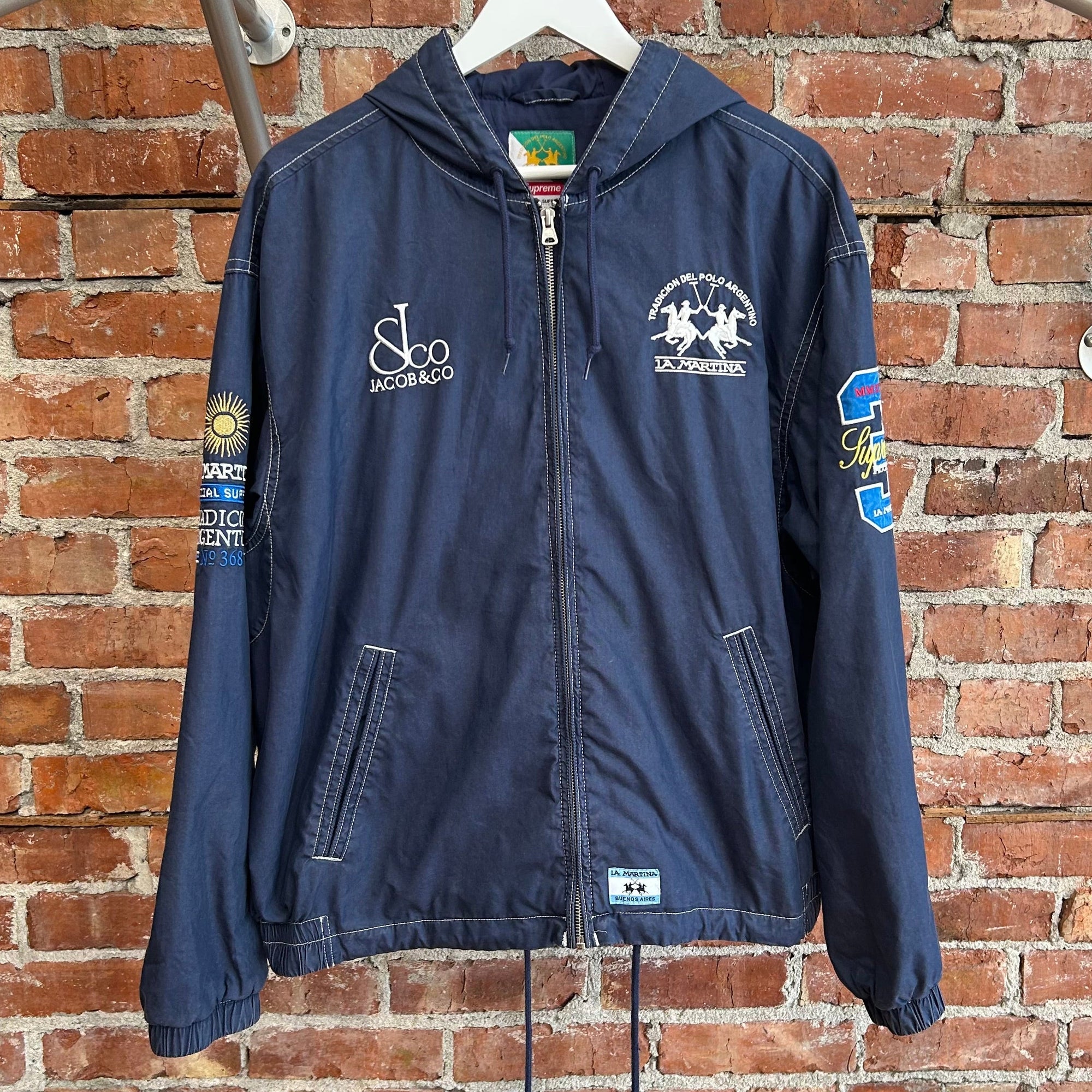 SUPREME X JACOB &amp; CO X LA MARTINA SS26 HOODED JACKET ‘NAVY’