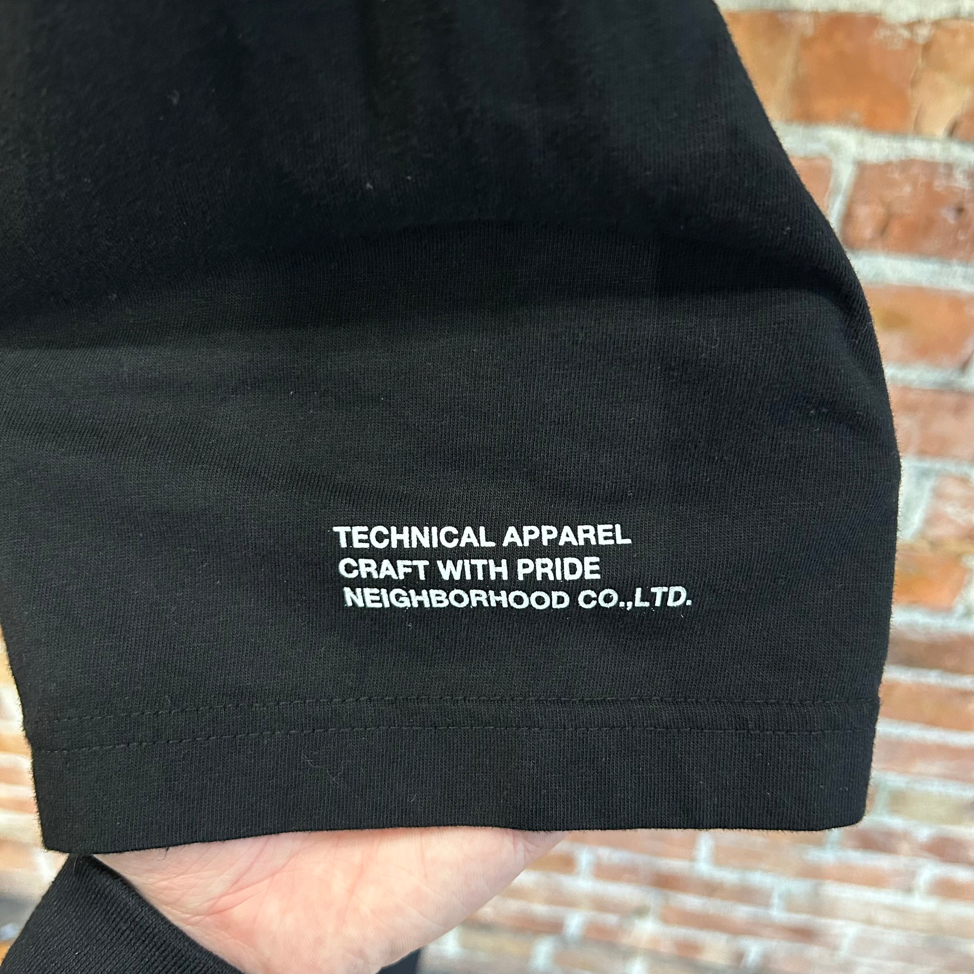 NEIGHBORHOOD TECHNICAL APPAREL OLD ENGLISH TEE ‘BLACK’