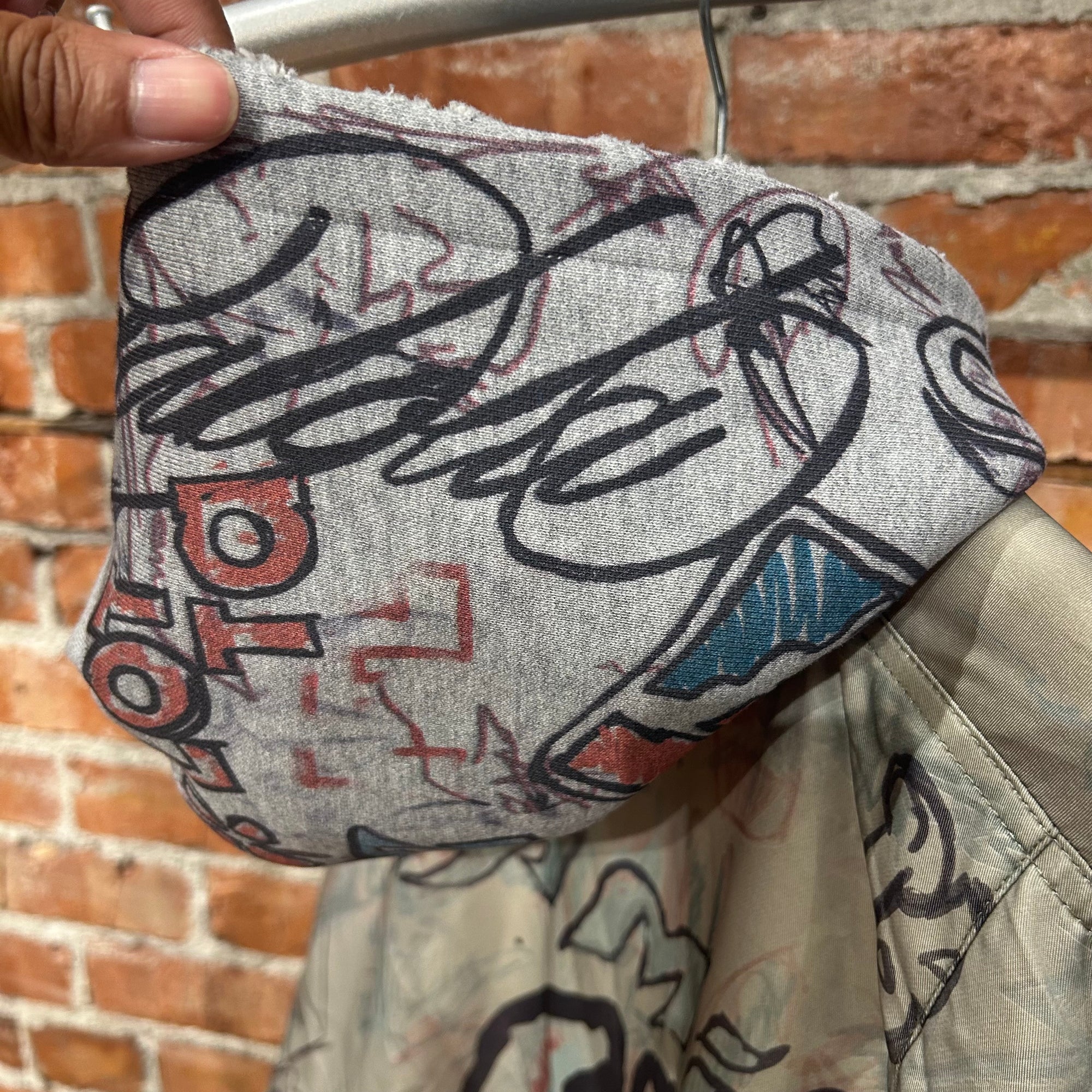 MOWALOLA HYBRID GRAFFITI HOODED BOMBER ‘SAGE’
