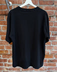UNDERCOVER FIGHT WAR NOT WARS TEE ‘BLACK’