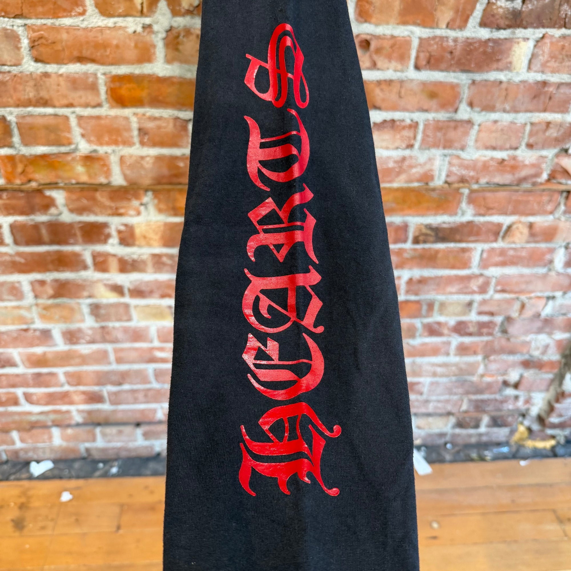 CHROME HEARTS VINTAGE SPELLOUT POCKET LONGSLEEVE ‘BLACK/RED’